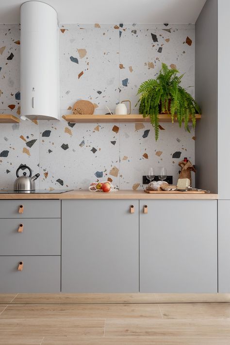 Terrazzo Tiles and Floating Shelf in Contemporary Kitchen This modern kitchen radiates calmness thanks to its soft color palette. Terazzo Kitchen Tiles, Terrazo Kitchen Splashback, Backsplash For Gray Cabinets, Terrazzo Tile Kitchen, Boho Kitchen Backsplash, Terrazzo Kitchen Floor, Terrazzo Backsplash, Kitchen Terrazzo, Terrazzo Kitchen