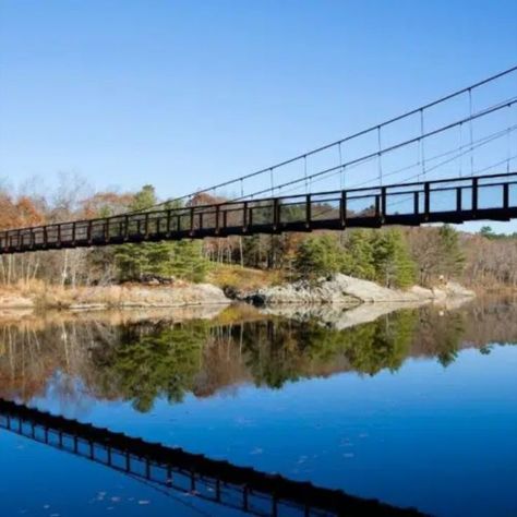 Narrow foot bridge over blue water with rocks and trees Lighthouse Quotes, Brunswick Maine, The Coast, Day Trip, Road Trips, Lighthouse, Maine, Road Trip, Take A