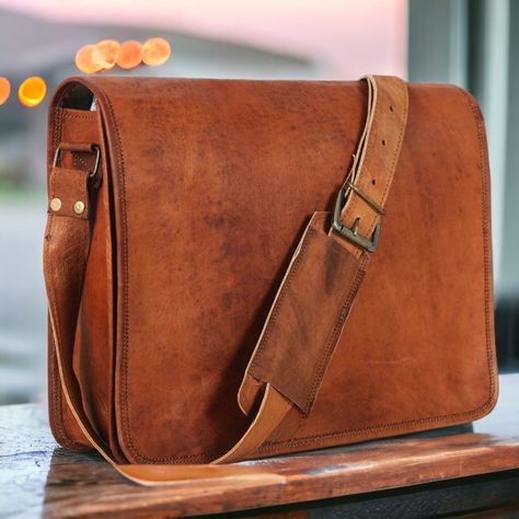 This Antique Style Crossbody Laptop Bag seamlessly blends style and functionality, ensuring it becomes an extension of your individuality making it one of the best laptop bags for work. With its spacious compartments and adjustable strap, it's designed to accommodate your essentials while offering comfort and elegance on the go. #crossbodybag #laptopbag #antiquestyle #leatherbag Crossbody Laptop Bag, Messenger Bag Leather, Leather Messenger Bag Men, Over The Shoulder Bags, Leather Laptop Bag, Leather Laptop, Messenger Bag Men, Mens Leather Bag, Laptop Bags