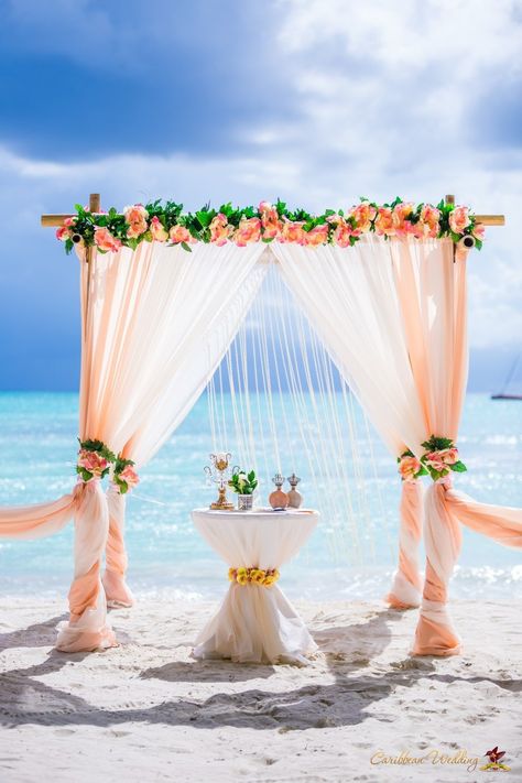 Peach Wedding Arch #weddingarch #peachweddingarch #wedding_arch #Peach_wedding_arch #peachwedding Peach Beach Wedding, Beach Wedding Table Settings, Gold Beach Wedding, Coral Wedding Decorations, Rich Wedding, Beach Wedding Coral, Beach Wedding Arch, Beach Wedding Tables, Beach Wedding White