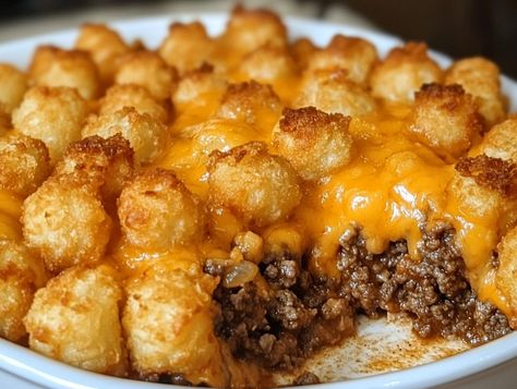 Tater tot casserole is the ultimate comfort food—warm, hearty, and irresistibly cheesy, making it the perfect dish for family dinners, potlucks, or any gathering. This classic American recipe brings ... Read more Stuffed Tater Tots, Best Tater Tot Casserole, Casserole With Ground Beef, Kumquat Recipes, Hamburger Casserole, Tot Casserole, Crowd Pleasing Recipes, Creamy Mushroom Sauce, Tater Tot Casserole