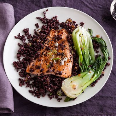 Enriched with the robust and healthy flavors of omega-packed salmon, freshly grated ginger, pure maple syrup, Japonica black rice, mirin, freshly chopped scallions or green onions, black sesame seeds, and healthy bok choy, this recipe is perfect for impressing that special, certain someone in your life on date night. Pop open your favorite bottle of dry white wine or crisp champagne and enjoy! Healthy White Rice, Black Rice Recipe, Ginger Salmon, Fish Recipes Healthy, Black Rice, Healthy Fish, Seafood Dishes, Dinner Menu, Salmon Recipes