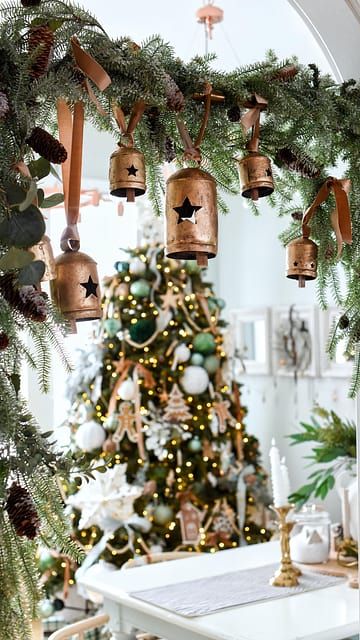 🔔🔔We just had to JUMP on this TREND … and we had to step it up a notch and add some of our BELLS!! What do you think? Would you try this trend? 🔔How did we do it? 🤎🤎We used a curtain tension rod and added some CHRISTMAS garland. I attached ours with green pine pipe cleaners.🤎🤎Tighten the tension rod between your walkway!! 🤎🤎Cut the jute off the bells and add some ribbon to your bells!! Simply tie the bells on the rod at varying lengths. This was about a 10 minute project with amazing results. I love the way it frames the Christmas tree!!🔔🔔Make sure to shop our entire collection of bells. What do we love about our bells with the star cutout? -they are perfect for other holidays!! Think Christmas, 4th of July and even Halloween!! Curtain Rod Garland Trend, Tension Rod Garland, Christmas Decor Inspiration, Tension Rod, Pipe Cleaners, Xmas Ideas, Christmas Ribbon, Pipe Cleaner, Christmas 2024