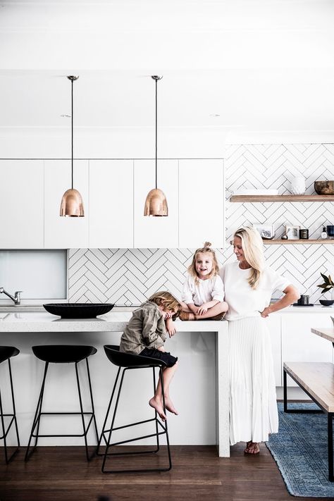 Metallic pendants add a luxe touch to this modern coastal kitchen. Modern Coastal Kitchen, Modern Coastal Decor, Contemporary Coastal, Coastal Kitchen, Kitchen Farmhouse, Farmhouse Style Kitchen, Ocean Inspired, Modern Farmhouse Kitchens, Western Decor