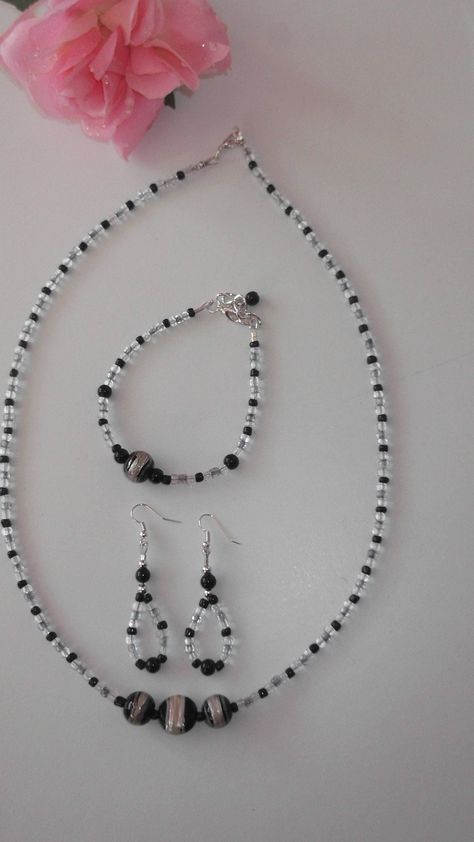 "Black , white and grey....the \"go anywhere, with anything\" colours...the \"classy colours\" of the spectrum The set is made of glass beads and glass seed beads and gives an elegant look The necklace is long enough to slip over the head without fiddling with a clasp...there is a lobster clasp length approx 24.5\" The earrings have a nice flow to their oval shape drop approx 2\" The bracelet fits an average 7\" wrist but there is an extender chain should you need it The set would make a lovely Grey Necklace, Gray Necklace, Glass Beads Jewelry, Beaded Jewellery, Floral Necklace, Purple Lilac, Jewellery Set, Glass Seed Beads, Flower Necklace