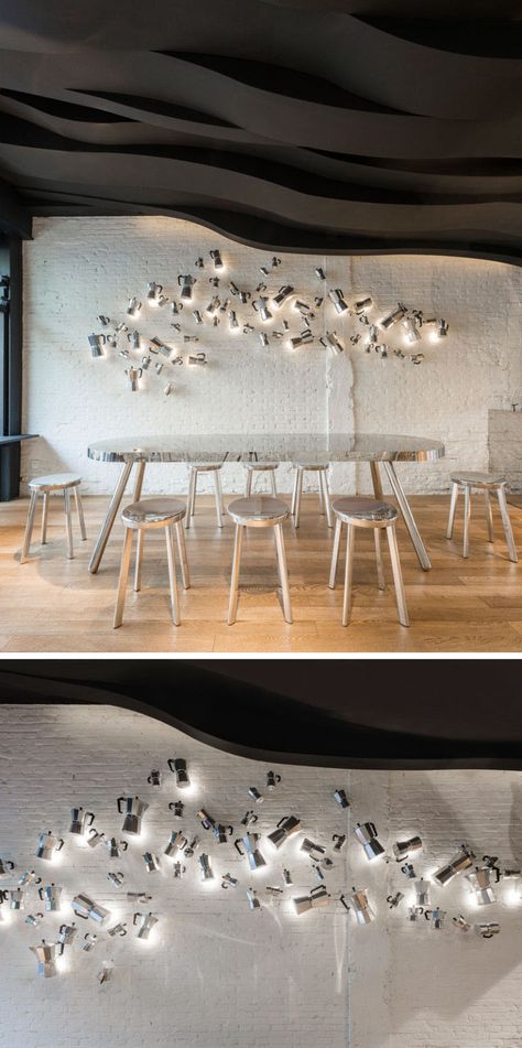 12 Ideas For Creating An Accent Wall Using Unexpected Materials // This cafe has a wall of Moka coffee pots that appear to be floating along its surface. Sculptural Ceiling, University Interior, University Interior Design, Cafe Bar Design, Academy Of Art University, Art University, Design Café, Interior Design School, Lounge Bar