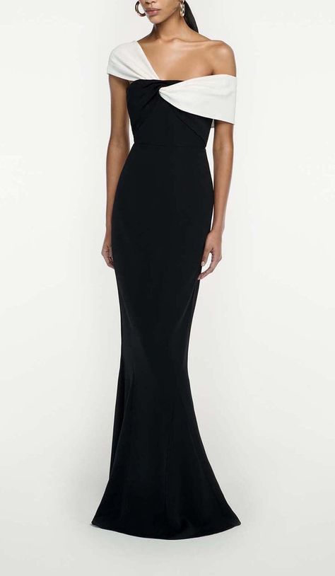 Make a Showstopping Entrance in This Dramatic Black Maxi Dress With an Asymmetric Off-The-Shoulder Ruffle Neckline. The Breezy Chiffon Skirt Sways Hypnotically as You Dance, While the Slim Bodice Hugs Your Shape. Accentuate the Waist With a Belt. Step Into the Spotlight and Let This Bold Maxi Dress Do the Talking Wherever You Go. Fitted bodice and fluted hem Fabric twist at bodice Internal corset Zip fastening at side Fully lined bodice Skirt unlined Main Fabric: 97% Viscose, 3% Elastane Contras Full Skirt Bridesmaid Dress, Maxi Dress One Shoulder, Off Shoulder Neckline Dress, A Line Skirt Dress, Black Tie Formal Dress Elegant, Designer Mother Of The Bride Dresses, Old Money Dresses Gala, Black Gown Wedding, One Shoulder Dress Outfit