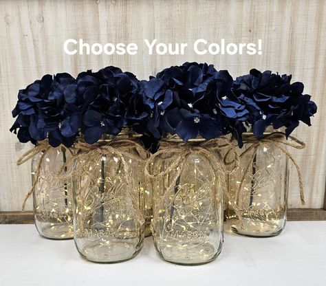 Set of 6 Navy Blue Hydrangea Lighted Mason Jar Centerpieces, Wedding Decor, Event Centerpieces, Mason Jars With Lights, Farmhouse Decor - Etsy Gold Silver Blue Table Setting, Diy Navy Blue Wedding Decor, Blue And Silver Birthday Centerpieces, Simple Prom Centerpieces, Navy Blue Hydrangea Wedding, Starry Night Theme Centerpieces, Starry Night Floral Arrangement, Navy Blue And Silver Wedding Centerpieces, Navy Blue Silver And White Wedding Centerpieces