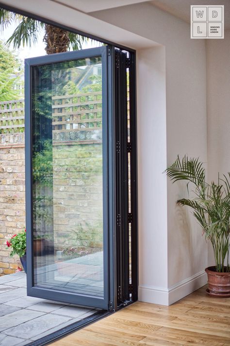 Exceptional Aluminium Bifold door by Windows Doors London. Contact us for more details. #AluminiumGermanWindows #German Windows #GermanWindowsLondon #AluminiumBifoldDoors#AluminiumCasementWindows #LondonWindows #AluminiumWindowsLondon #Aluminium Windows #AluminiumWindowsSurrey #SurreyWindows #WDL #WindowsDoorsWindows #WindowsSupplierLondon Pintu Lipat Aluminium, Aluminium Windows Ideas, German Windows, Bifold Door Ideas, Bifold Windows, Aluminum Windows Design, Aluminium Bifold Doors, Modern Kitchen Extensions, Modern Windows And Doors