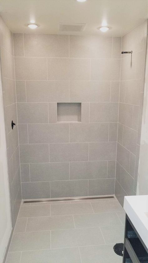 Shower Tile Same As Floor Tile, Shower Remodel With Large Tile, Big White Tile Bathroom Walls, Wide Tile Bathroom, Large Tile On Bathroom Walls, Large Tile For Bathroom, Large Tile In Shower Stall, Large Tile For Shower Floor, Small Shower Large Tile