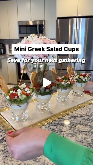 Reina G. Slim on Instagram: "Mini Greek Salad Cups 🥗 What you will need 👇🏻

Rather than the usual Greek Salad in a big bowl, why not layer in a clear cup when hosting? Not only they look so amazing and delicious but they sure will wow your family and friends when entertaining! Here’s what you will need: 👇🏻

Ingredients:
▫️Hummus (Classic ) @cedarsfoods 
▫️Tzatziki sauce @cedarsfoods 
▫️Kalamata olives (sliced)
▫️Marinated Artichokes (sliced) 
▫️Romaine lettuce (shredded) 
▫️Cucumbers ( diced)
▫️Cherry tomatoes (halved)
▫️Red onions (diced) 
▫️Feta cheese (crumbled)
▫️Fresh dill for garnish (optional) 
▫️Mini Naan dippers @stonefirenaan 

▫️Clear disposable cups ( I didn’t have any on hand that’s why I used glass)
▫️Mini appetizer forks

Follow along to see how I prepared these heavenl Greek Salad Cups, Salad Appetizers In A Cup, Salad Plating Presentation, Salad Cups For Party, Naan Dippers, Mini Naan, Greek Salads, Salad Cups, Marinated Artichokes