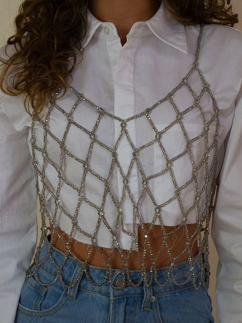 Girl wearing a white long sleeve with a beaded overlay tank Rhinestone Tank Top Outfit, Jeweled Top Outfit, Beaded Tank Top, Cooler Aesthetic, Outfits For Miami, Beaded Top Outfit, Outfits For Vegas, Cami Top Outfit, Vegas Outfits