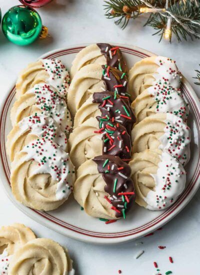 Chocolate Dipped Danish Butter Cookies - Cookin' with Mima Danish Butter Cookies Recipe, Butter Cookies Christmas, Danish Cookies, Cookie Recipe Video, Danish Butter Cookies, Chocolate Dipped Cookies, Baking Treats, Dipped Cookies, Butter Cookies Recipe