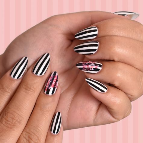 Flashback to the Y2K era with this black and white striped floral nail art! 🖤✨ • • • • • • #hellobirdie #hellobirdienails #nailart #nailartsandiego #sdnailart #nailsofig #nailsofinstagram #northparknails #northparknailsalon #explorenorthpark #northpark #supportlocalart #shopsmall #modernnailart Pinstripe Nail Designs, Black And White Stripe Nails, Pin Stripe Nails, Black And White Nails Stripes, Striped Nails Black And White, Vertical Stripe Nails, Halloween Nails Stripes, White With Black Stripes Nails, Nail Stripes