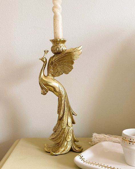 Our Gold Peacock Candle Holder is a beautiful and elegant addition to your home decor. Perfectly refined, it is an absolute eye-catcher that lights up your home in an elegant way. The lustrous gold finish is warm and inviting, providing a beautiful glow when burning a candle. If you love collecting candles or have been gifted a couple of them and are yet to set them up, this unique piece is the ultimate pick. We love it in combination with our Ceramic Nespresso Cup Caftan, Ceramic Tray Caftan an Peacock Candle, Twisted Candle, Paradise Bird, Twist Candle, Gold Peacock, Gold Rooms, Ceramic Tray, Unique Candles, Candle Set