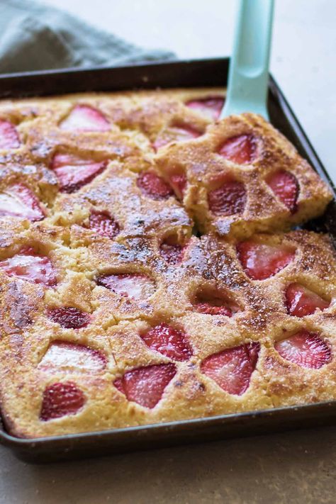 Breakfast just got easier with these sheet pan pancakes. Instead of standing at the stove flipping pancakes, make the batter and bake it in the oven. Slice and serve these pancake squares with warm maple syrup and powdered sugar for an easy weekend breakfast. Strawberry Sheet Pan Pancakes, Pancake Squares, Easy Pancake Batter, Easy Weekend Breakfast, Eat Cheap, Easy Spring Recipes, Sheet Pan Pancakes, Pan Pancakes, Easy Egg Recipes