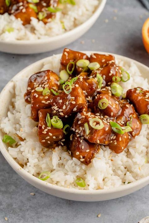 This vegan take on a classic orange chicken recipe checks all the boxes! A crispy pan-fried tofu smothered in a zesty orange sauce-- it can be made gluten-free, is easy to prepare, and ready in about an hour. #orangetofu #vegantakeout #vegandinner #veganentree #chineseamerican #pandaexpress #sweetsimplevegan Vegan Take Out, Cooked Tofu, Orange Tofu Recipe, Firm Tofu Recipes, Orange Tofu, Tofu Chicken, Toasted Sesame Oil, Serve Over Rice, Orange Chicken Recipe