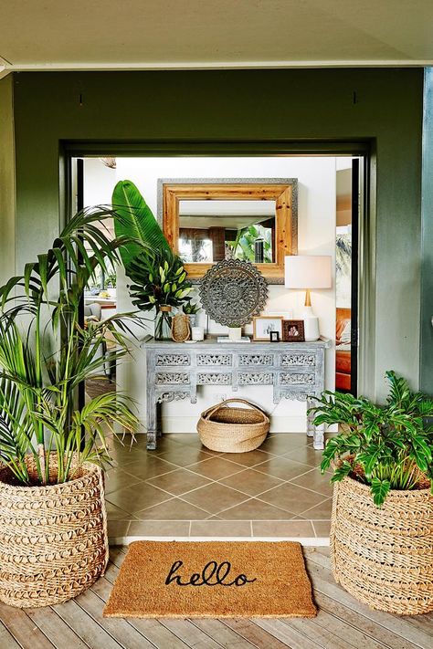 A mix of exotic or tribal homewares add to the Balinese-style entryway. | Photo: Will Horner Balinese Interior, Bali Style Home, Bali Decor, Balinese Decor, Door Planter, Tropical Interior, Tropical Home Decor, Inviting Home, Tropical Houses