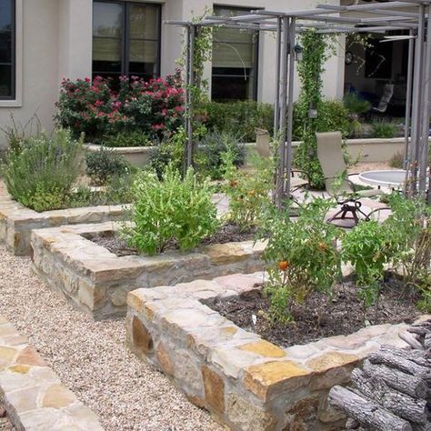 Stone edges and raised beds built with rocks, bricks or decorative concrete stones add charming accents to backyard landscaping and garden design. Stones bring gorgeous contrasts with blooming flowers Tuscan Garden, Garden Boxes Raised, Vegetable Garden Raised Beds, Building A Raised Garden, Mediterranean Landscaping, Garden Vines, Mediterranean Garden, Charming Garden, Vegetable Garden Design