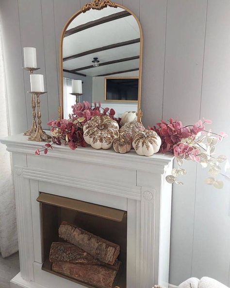 Fall into Cozy: 20+ Warm & Stylish Mantel Ideas for Autumn - Curbly White Fireplace Mantel, Meaningful Signs, Pink Fireplace, Gold Arched Mirror, Cream Fireplace, White Fireplace Mantels, Gold Arch Mirror, Pink Garland, Glittery Pumpkins