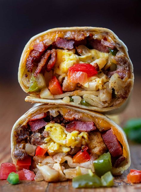 A Cowboy Breakfast Burrito is a savory and hearty breakfast option loaded with meats, vegetables, seasonings, eggs, and cheese wrapped in a tortilla and pan-fried to perfection! It is sure to satisfy even the biggest appetites and keep you going all morning. Ultimate Breakfast Burrito, Cowboy Breakfast Burrito, Breakfast Truck Ideas, Breakfast Ideas For Restaurant, Fried Egg Breakfast Ideas, Steak Breakfast Burrito, Unique Breakfast Ideas, Burritos Recipes, Cowboy Breakfast