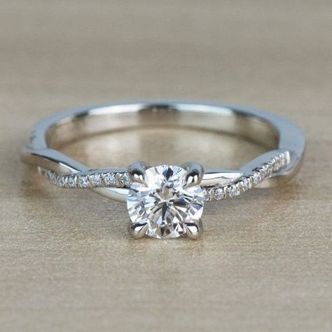 This gorgeous 1.00 carat diamond set in claw prongs surrounded but a twist of pave set diamonds is a perfect simple floral-inspired option that allows for an abundance of sparkle. Side Stone Ring, Pretty Engagement Rings, Engagement Rings Twisted, Cute Engagement Rings, Future Engagement Rings, S Ring, White Gold Diamond Engagement Ring, Side Stone Engagement Ring, Gorgeous Engagement Ring