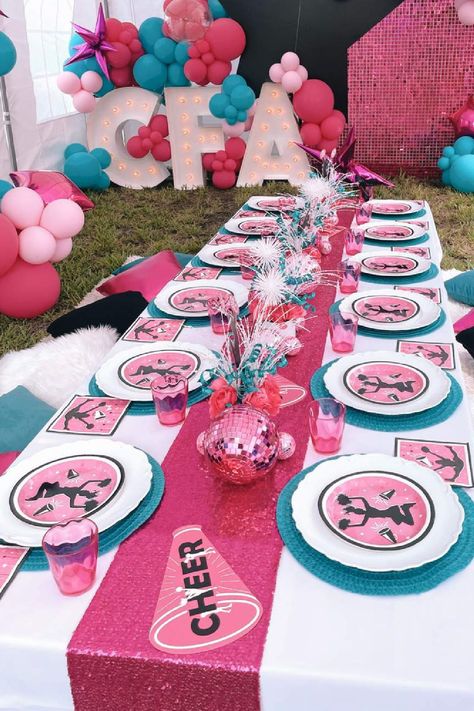 Don't miss this pretty cheerleading birthday party! The table settings are fab! See more party ideas and share yours at CatchMyParty.com Cheerleading Table Centerpieces, Cheerleading Birthday Party Decorations, Cheer Pool Party Ideas, Cheer Theme Birthday Party, Cheer Birthday Party Decorations, Football And Cheer Birthday Party, Cheerleader Themed Birthday Party, Cheerleading Themed Birthday Party, Cheerleader Party Ideas