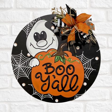 "Boo Yall" Wood door hanger - 18" Round Perfect door hanger for Halloween Items used: 18" printed door hanger, ribbon, hot glue, jute twine (hanger) Item is ready to ship out- What you see in photo will be the actual item you receive. Color of actual product may look slightly different than how it appears on your computer or cell phone screen due to difference in screens. Boo Yall, Cell Phone Screen, Halloween Door Hangers, Ghost Decoration, Round Door, Wood Door Hangers, Halloween Door, Halloween Items, Jute Twine