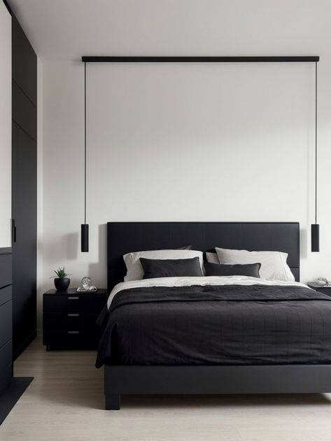 Create a bold and modern look in your bedroom with a matte black accent wall. Pair it with sleek and minimalistic furniture, such as a platform bed and a floating shelf, for a contemporary vibe. Matte Black Accent Wall, Dark Bedroom Interior, Black Bedroom Decor Ideas, Minimalistic Furniture, Black Accent Wall, Low Platform Bed, Black White Bedrooms, Monochrome Bedroom, Black Bedroom Decor