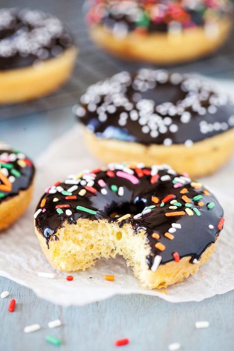 What looks like a donut but isn't fried? This easy baked donut recipe! These delicious yellow cake mix donuts are perfect for when you want a tasty treat to satisfy your sweet tooth. You don't need a donut pan. You'll love the chocolate frosting and sprin Cake Mix Donuts Recipe, Easy Donut Recipe Baked, Baked Donut Recipe, Cake Mix Donuts, Cake Donuts Recipe, Recipes Using Cake Mix, Baked Donut, Easy Donuts, Mini Cheesecake Recipes