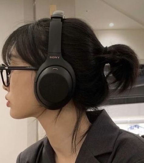 A Woman, Headphones, Mirror