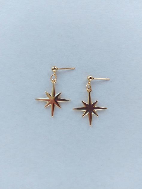 The earrings are adorned with a small star-shaped pendant. The earrings are fastened with stainless steel studs. Earring length - 3.0 cm (1.2 inches) The earrings are packed in a gift box. RECOMMENDATIONS FOR CARE: Do not wet, do not drop, and store in a dark box! - Remove jewelry before exercising, swimming, showering and sleeping. - Avoid contact with moisture such as make-up, moisturizer, lotion, perfume and hairspray. - Store your jewelry in a box or pouch after use. Rock Jewelry Earrings, Drop Stud Earrings, Celestial Earring, Dangly Earring, Star Jewellery, Polar Star, Gold Star Earrings, Star Earring, Silver Star Earrings