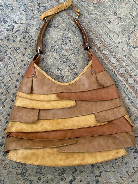 "Vintage handbag made of layered leather with wooden handles. This is a very unusual bag from the 1970s. You cannot go wrong with this. It would be great for in the fall, summer and any vintage look. Absolutely a awesome handbag. Measurements 13\" across 11\" tall" Vintage Handbag, Christmas Sewing, How To Make Handbags, The 1970s, Vintage Handbags, In The Fall, Wooden Handles, Leather Handbag, Vintage Look