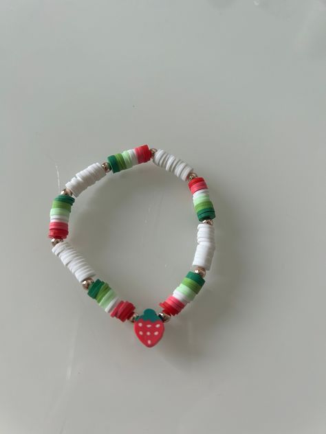 strawberry themed clay bead bracelet! Stretchy but don't stretch too much or it could break/stretch out Strawberry Clay Bracelet, Strawberry Clay Bead Bracelet, Clay Bracelet Patterns, Strawberry Bead Bracelet, Cute Bracelets Ideas Beads, Cute Clay Bead Bracelet Ideas, Bracelet Ideas Clay Beads, Clay Beads Ideas, Clay Bead Ideas