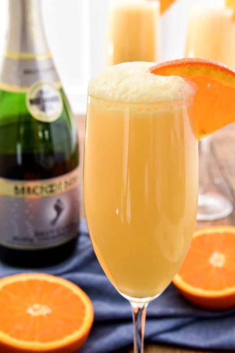 Take your favorite breakfast cocktail to the next level with these delicious Orange Creamsicle Mimosas! They combine the fun of childhood with the deliciousness of adulthood....all in one glass. Made with 4 simple ingredients, these mimosas are just the right blend of creamy, sweet, and bubbly. Perfect for weekend brunches, ladies' nights, or lazy days by the pool. If you love mimosas (and who doesn't!?) you'll love this fun, creamy, YUMMY twist! Orange Creamsicle Mimosa, Creamsicle Mimosa, Breakfast Cocktails, Mimosa Recipe, Orange Wedges, Vanilla Vodka, Orange Sherbet, Orange Creamsicle, Grandmas Recipes