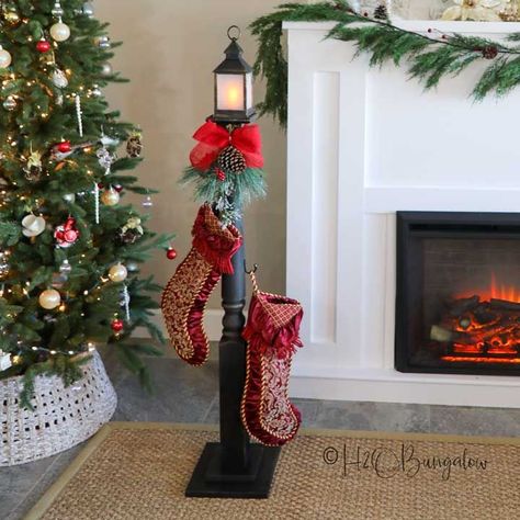 Create a freestanding Christmas stocking holder that looks like a vintage street lantern by following this step-by-step tutorial. Diy Stocking Holder Stand, Christmas Tree Stand Diy, Christmas Stocking Stand, Puppy Whelping, Free Standing Stocking Holder, Stocking Holder Stand, Diy Stocking Holder, Stocking Stand, Camo Christmas