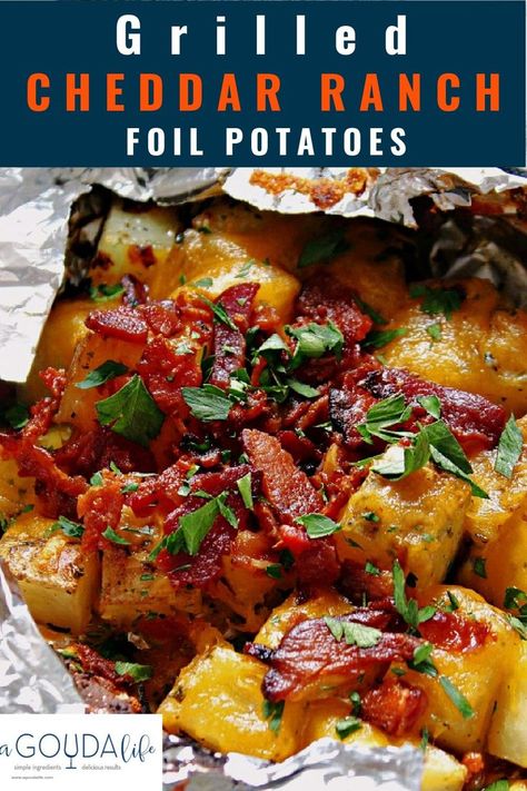 Grilled Cheddar Ranch Potatoes with crispy bacon cooked in foil packets. Finish with a dollop of sour cream - easy hobo camping or backyard recipe - can also be made in the oven. #potatoes #grilledpotatoes #foilpotatoes #potatoesinfoil #grillrecipes #summerrecipes #agoudalife Foil Potatoes On Grill, Campfire Potatoes, Loaded Potatoes, Grilled Side Dishes, Foil Pack Meals, Foil Packs, Potato Dinner, Bacon Potato, Grilling Sides