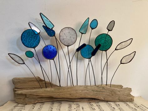 Stained glass flowers and grasses on driftwood Fused Glass And Driftwood, Driftwood Stained Glass Art, Stained Glass Driftwood, Stained Glass Wood, Stained Glass On Driftwood, Stained Glass And Driftwood, Stained Glass Scraps Ideas, Driftwood Stain, Island Crafts