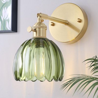 Illuminate your space with vintage charm using our Vintage Glass Wall Sconce. Featuring an elegant brass frame and warm tone, it adds a nostalgic touch to any room. Shade Color: Green, Size: 4.33" H x 4.33" W x 5.91" D | Mercer41 Kamar Accent 4.33 H x 4.33 W x 5.91 D in / yellowGlass in Green | 4.33" H x 4.33" W x 5.91" D | Wayfair Sconces Bathroom, Sconces Living Room, Brass Sconces, Vintage Wall Sconces, Twin Lakes, Sconces Bedroom, Princess Tiana, Vintage Green Glass, Bathroom Wall Sconces