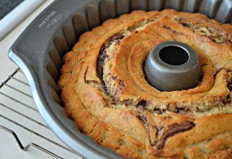 This Nutella Swirl Banana Bundt Bread is Nutella mixed in to a banana bread batter and shaped into a beautiful bundt cake - perfect with a cup of coffee! Nutella Bundt Cake, Bundt Bread, Nutella Coffee, Nutella Banana Bread, Banana Bundt Cake, Banana Bundt, Bundt Recipes, Chocolate Hazelnut Cake, Chocolate And Vanilla Cake