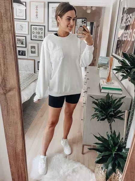 This sweatshirt is one of my favs! Wearing a size XS. It has an oversized fit. Wearing a size 4 in the shorts & sneakers fit TTS. Sweatshirt, active, activewear, athleisure, biker shorts, pullover, fall sweater, casual style, white sneakers, fall outfit. Fall White Athleisure Sweatshirt, White Sneakers Fall Outfit, Fall Boxy Fit Athleisure Sweatshirt, Oversized Athleisure Crew Sweats, Sneakers Fall Outfit, Athleisure Sweat-resistant Biker Shorts, Athleisure Sweat-resistant Shorts, Style White Sneakers, Fall Loungewear