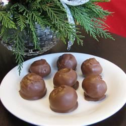 Also known as buckeyes, these balls of peanut butter with a chocolate coating are a holiday cookie platter mainstay. Graham Balls, Peanut Butter Balls Recipe, Butter Balls, Peanut Butter Balls, Melting Chocolate Chips, Chocolate Coating, Balls Recipe, Cereal Recipes, Graham Cracker Crumbs