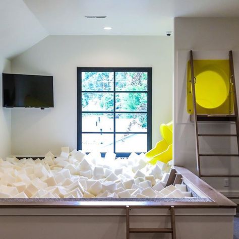 Take life like a foam pit and JUMP IN! #holladayhaven #treehavenhomes #dreamitdesignitbuildit #modernfarmhouse #awardwinningbuilder #creativebuilds #customhomes #customhome #customhomebuilder Playroom Slide, Modern French Chateau, Indoor Slide, Foam Pit, French Chateau Style, White Grout, Chateau Style, Home Bunch, French Country Bedrooms