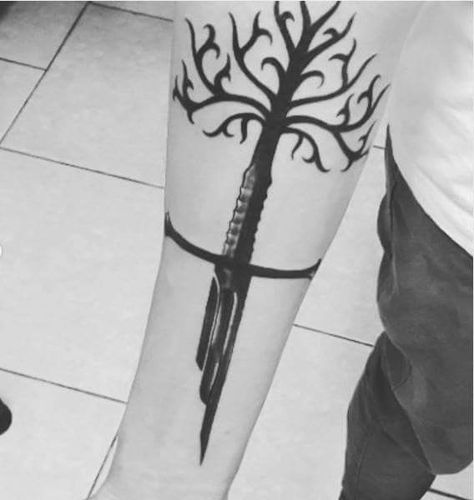 From design.. to skin! Eliezer Suárez Jr's original tattoo design of the Tree of Gondor giving way to Narsil (later reforged into Andúril) #TolkienTattoos  #mpfwshop myprecious.us #LOTR #LOTRJewelry Lord Of The Rings Narsil Tattoo, Gondor Tattoo, Lord Of The Rings Tattoo Narsil, Ent Tattoo Lord Of The Rings, Lord Pf The Rings Tattoos, Lord Of The Rings Tattoo Anduril, Lotr Jewelry, Tattoo Aesthetics, Earth Tattoos