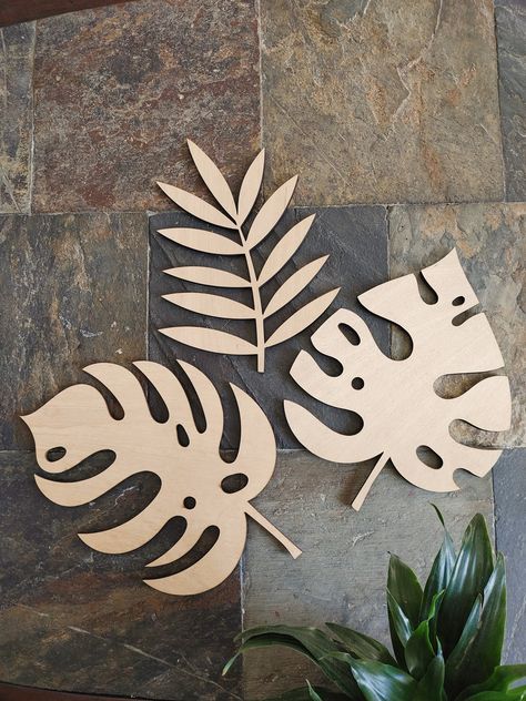 Fun and unique monstera Leaf cutouts - perfect for tropical party decor, kids birthday, baby shower , wedding, housewarming , home decor. Designed and handcrafted with love and care in my studio in Oregon PRODUCT DETAILS : - Wood Monstera Leaf Cutout 10in x 7.5in - Unpainted 1/8in plywood - Light weight . - Sell per piece . HARDWARE: We do not include hardware ! You can use double sided tape ( 1lb) or mini nails If you wish to personalize the product , or have any questions/concerns , please mes Plywood Decor, Mini Nails, Simple Room Decoration, Summer Party Decor, Hanging Leaf, Dance Crafts, Leaf Cutout, Tropical Party Decorations