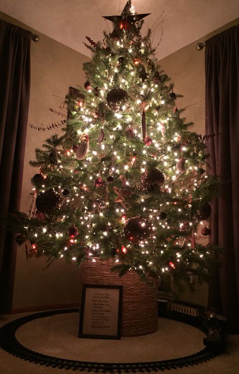 Christmas tree in a basket. A great way to make room under the tree for presents, villages, or in this case a train. Christmas Tree With Train, Christmas Tree In A Basket, Christmas Tree Basket, Xmas Activities, Christmas Tree In Basket, Christmas Tree Train, Tree Basket, Diy Tree, Under The Tree