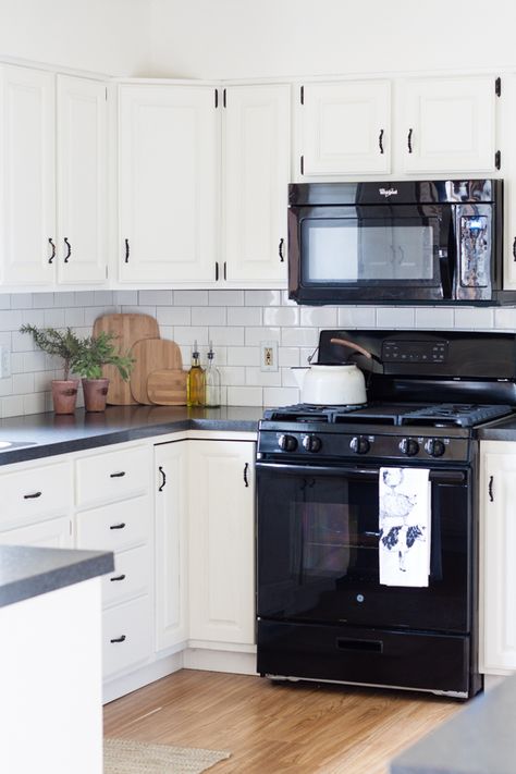 Black and White Farmhouse Kitchen Makeover Kitchen Tile Black And White, White Farmhouse Sink With Black Faucet, White Farm Sink Black Faucet, White Farmhouse Sink Black Cabinets, White Farmhouse Sink Black Faucet, Black And White Farmhouse Kitchen, Farmhouse Kitchen Makeover, White Farmhouse Kitchen, Black And White Farmhouse