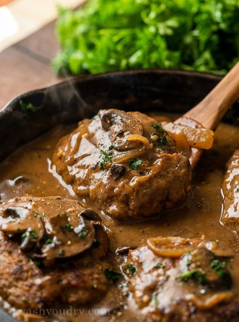 All you need is 30 minutes to whip up this super easy Salisbury Steak Recipe. Filled with seasoned ground beef "steaks" and simmered in a rich mushroom gravy, this dish is best served over creamy mashed potatoes! Salisbury Steak Easy, Creamy Beef Stroganoff Recipe, Easy Salisbury Steak Recipe, Easy Fall Dinner Recipes, Salisbury Steaks, Homemade Salisbury Steak, Easy Salisbury Steak, Salisbury Steak Recipe, Hamburger Steaks