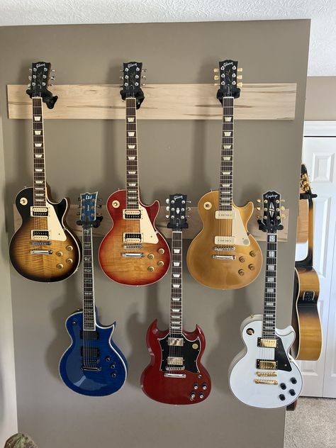 Display Guitars On Wall, Hanging Guitars On Wall Ideas, Guitar Hung On Wall, Guitar Hanging Ideas Wall Mount, Guitar Hanging On Wall, Guitars Hanging On Wall, Iphone Wallpaper Rock, Hanging Guitars, Angelic Art