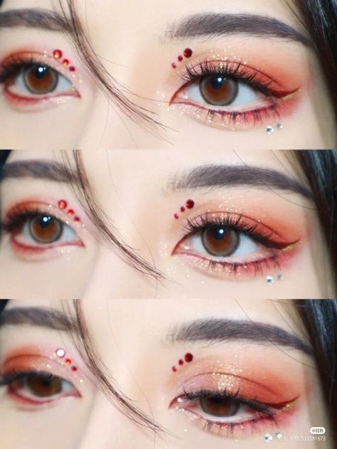 Red Asian Eye Makeup, Red Eyeshadow Rhinestones, Jewel Eye Makeup Rhinestones, Red Eyeshadow Makeup Looks, Simple Red Makeup, Red And Gold Makeup Looks, Simple Red Makeup Looks, Red Douyin Makeup, Christmas Makeup Looks Simple